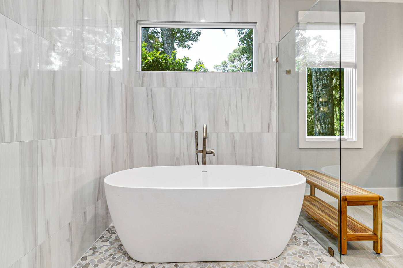 Freestanding tub under a clerestory window