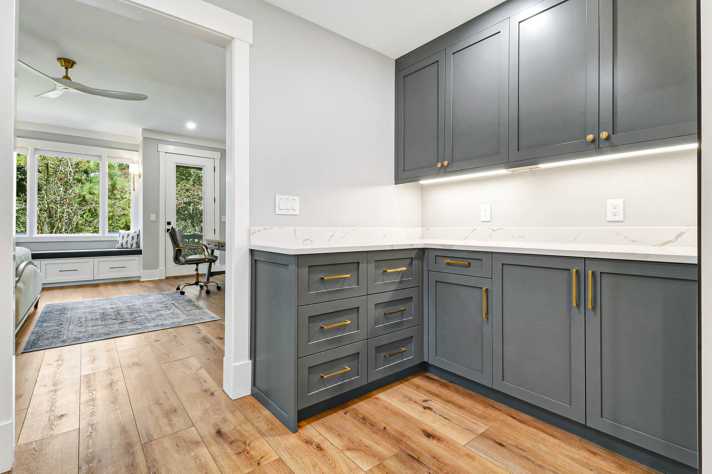 Painted shaker cabinets with under-cabinet lighting